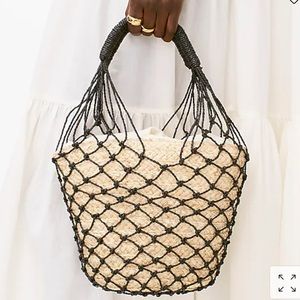 Raffia bucket bag with netting overlay
Item AZ135
